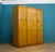 A vintage birch and walnut Art Deco triple door wardrobe, circa 1930s. Inside, beautifully fitted out with a a clothes,...
