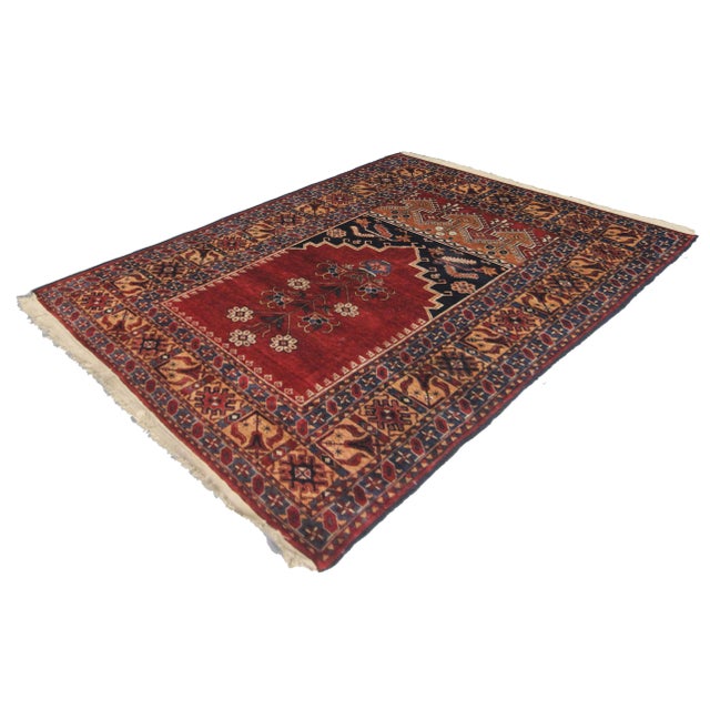 Hand knotted of top quality vegetable dyed silk in the 1900's. This extremely fine rug is an eye-catching example that...