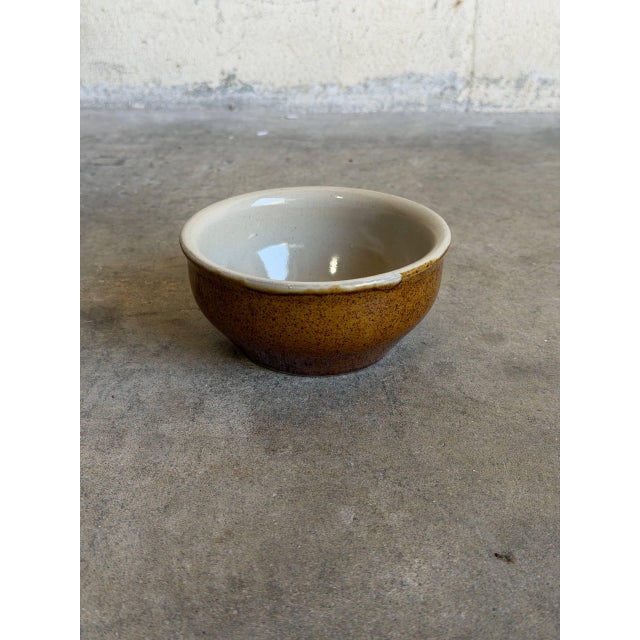 Vintage 1960s French Mid-Century Modern small ceramic bowl highlights an organic, rustic aesthetic with a functional...