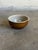 Vintage 1960s French Mid-Century Modern small ceramic bowl highlights an organic, rustic aesthetic with a functional...