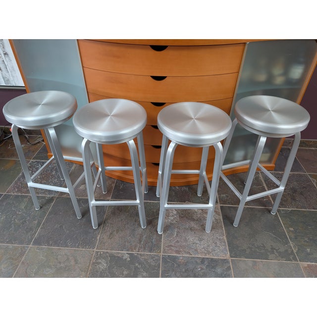Design Plus Gallery presents a Set of Four Swivel Bar Stools from Crate & Barrel. The stools are welded from aluminum and...