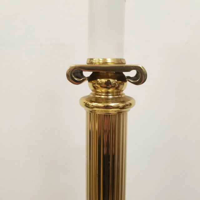 Sophisticated vintage brass table lamp inspired by the grandeur of Corinthian architecture. The lamp features a fluted...