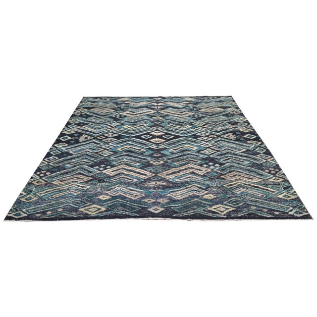 Hand-knotted with care using traditional rug making techniques, this wool rug blends timeless craftsmanship with a modern...