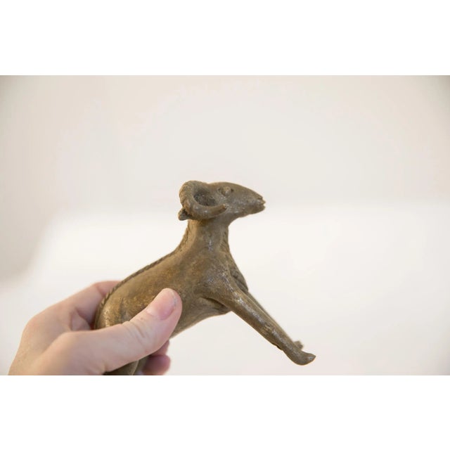 :: Vintage handmade African ram sculpture. Circa late mid 20th century, though possibly older, this piece has such...