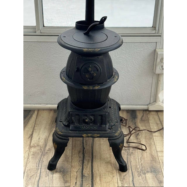 Striking and full of character, this antique style Cast Iron Stove Lamp is a stove design. rare decorative piece that...