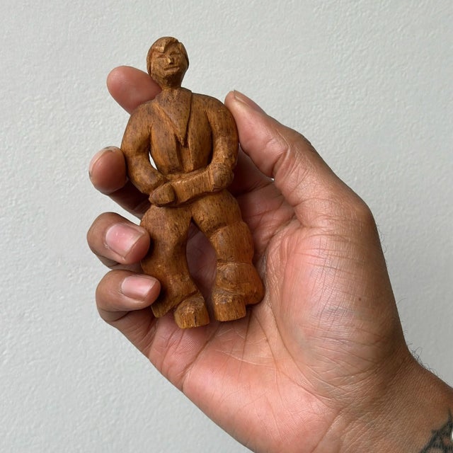 Vintage Miniature Carved Rancher Sculpture with Barrel Jeans, Circa 1940s. Carved from a singular piece of wood with...
