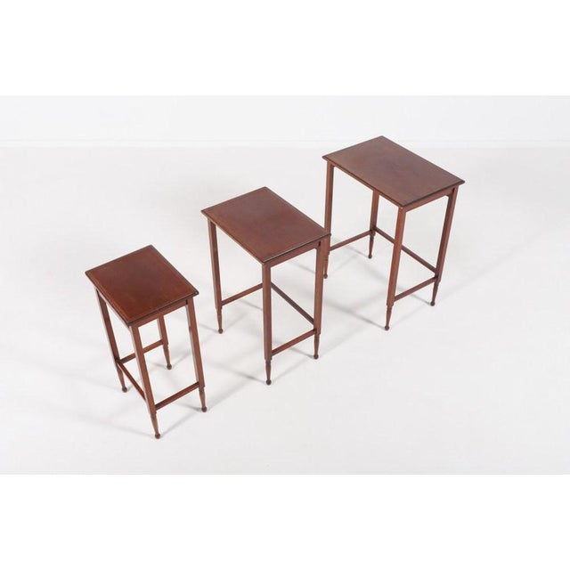 Mid-Century Modern Swedish mahogany nesting side tables produced in Sweden by Nordiska Kompaniet, 1950s. Condition Age...