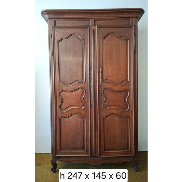 Louis XV period solid oak wardrobe. 18th century Opening with two doors, this wardrobe offers elegant simplicity and...