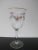 Very sweet vintage wine glass. Clear glass with hand painted colorful floral and bow design. Rim has gold gilt accent....