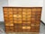 Design Plus Gallery presents an Apothecary Cabinet with Thirty-Two Drawers. These drawers are arranged in four columns of...