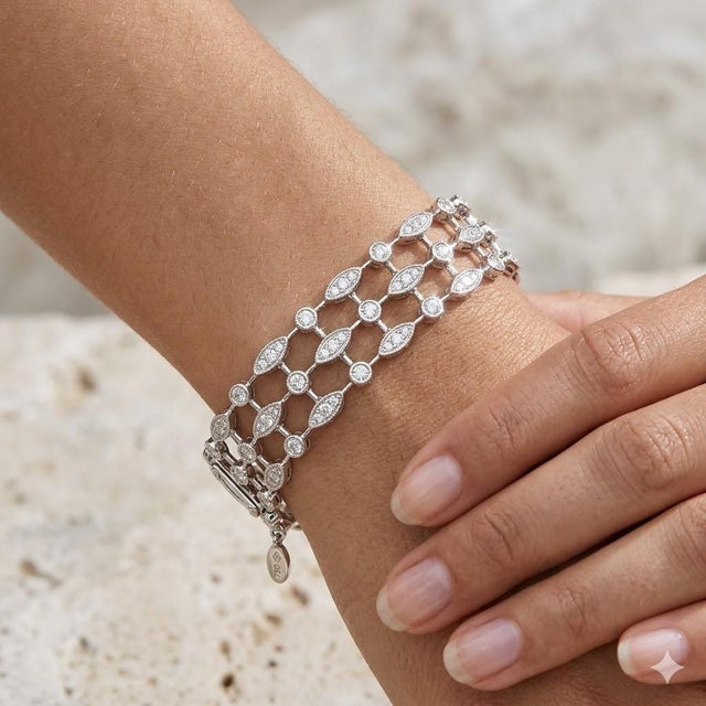 18k Martin Flyer white gold triple row filagree diamond bracelet. 196 round diamonds weighing 4.36 carats. 23.28 grams