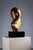 This brass sculpture embodies the Futurist-Cubist style with a distinctly modernist edge. The elongated head, stylized...