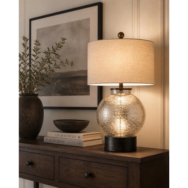 A beautifully balanced blend of texture, tone, and scale, this crackle glass globe table lamp delivers a refined,...