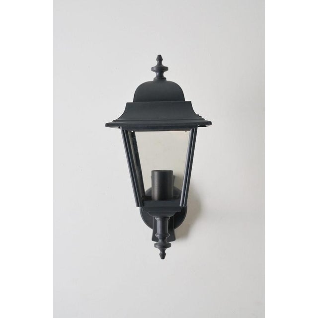Substantial outdoor wall lamp, produced by the Italian manufacturer Lothus. It is the larger version of the classic...