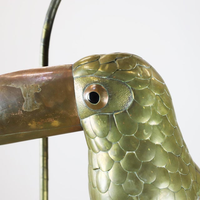Copper, brass and aluminium Toucan on a hoop hanging stand by Sergio Bustamante, circa 1960. Sergio Bustamante is a...