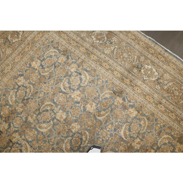 an early 20th-century Persian Tabriz with Classic all-over herati design. Soft blue field with predominant accents in...