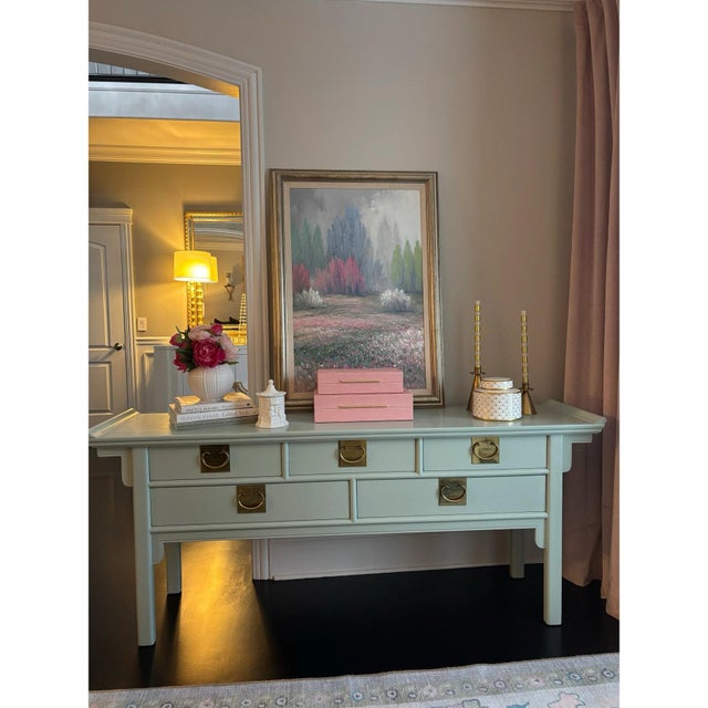 Offered is an chinoiserie style sideboard made from solid wood painted a lovely soft pale green with large polished...