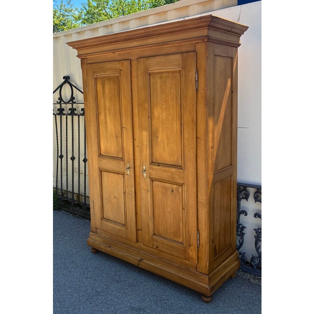 A magnificent armoire such as this, over seven feet high and more than five feet wide at the tip of the crown, would be...