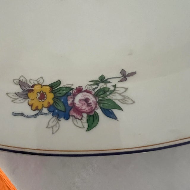 B & C Limoges France serving platter. Gold embellished handles complement the floral pattern of pink, yellow and blue. ....