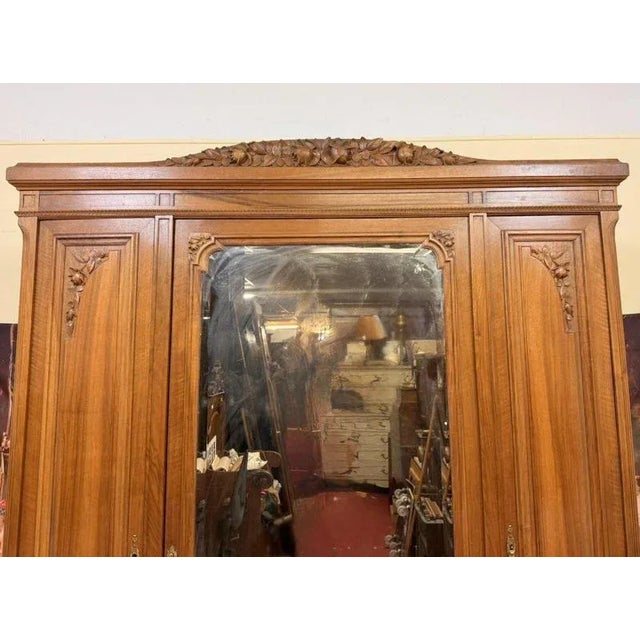 Art Deco period walnut cabinet 3 doors, one with mirror 3 drawers carved decorations ogival legs h 225 x 165 x 51