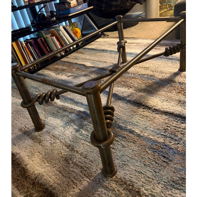 The base is built with heavy cylindrical legs, round bun feet, and an X-frame stretcher accented with sculptural, hand-...