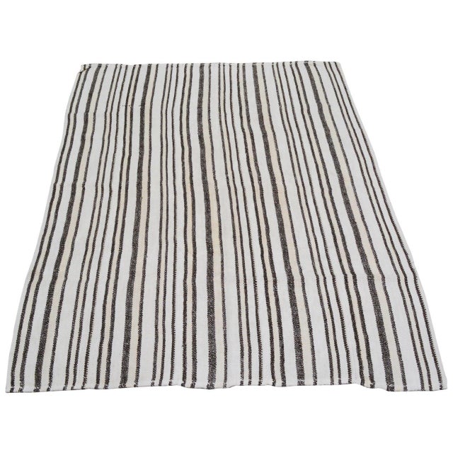 Flatweaved with care using traditional rug-making techniques, this hemp rug blends timeless craftsmanship with a modern...