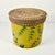 This is a really nice decorative storage box. The round box features a wicker rope lid over a Bamboo leaf motif covered...