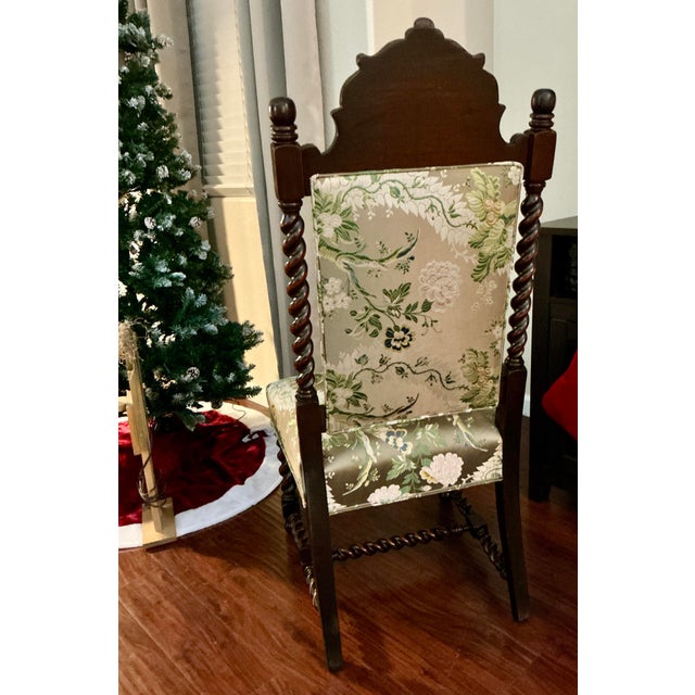 This exquisite Victorian barley twist chair showcases the rich warmth and refined elegance of solid walnut, its frame...