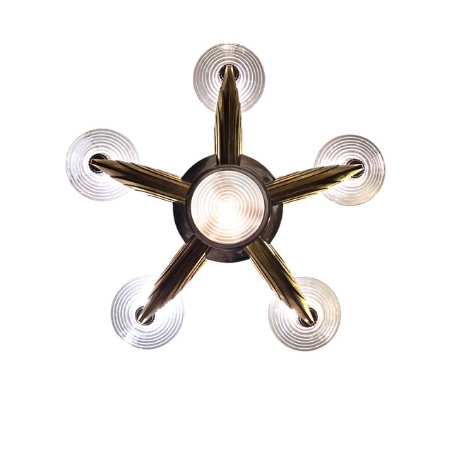 Dramatic Machine age five-arm chandelier signed Petitot Paris featuring a central column of vertical ribbed glass rods...