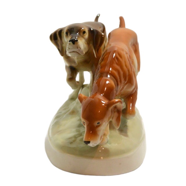 Elevate your library or mantel with this exquisite mid-century porcelain sculpture from the renowned Royal Dux Bohemia...