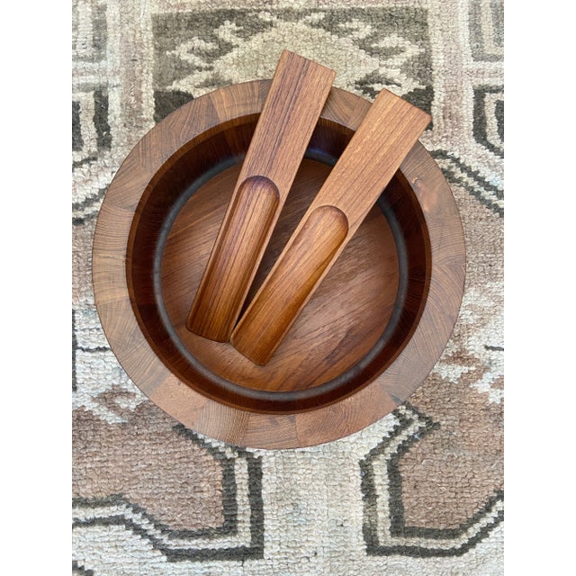 Oversized teak wood DANSK Salad Bowl & Server Set. All 3 pieces have DANSK maker stamp on underside. Bowl measurements:...
