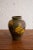 Royal Haeger urn form vase from the "Earth Wrap" series. Green base coat with abstract textured yellow and brown top...