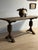 An extraordinary 17th-century French oak dining table showcasing exquisite craftsmanship and sculptural form. Its trestle...