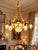 1970 French Artisan Louis XVI Gold Bronze Chandelier For Sale - Image 14 of 18