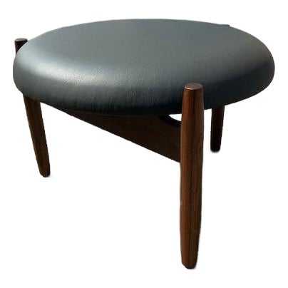 Mid Century Style Round Walnut and Black Leather Ottoman For Sale