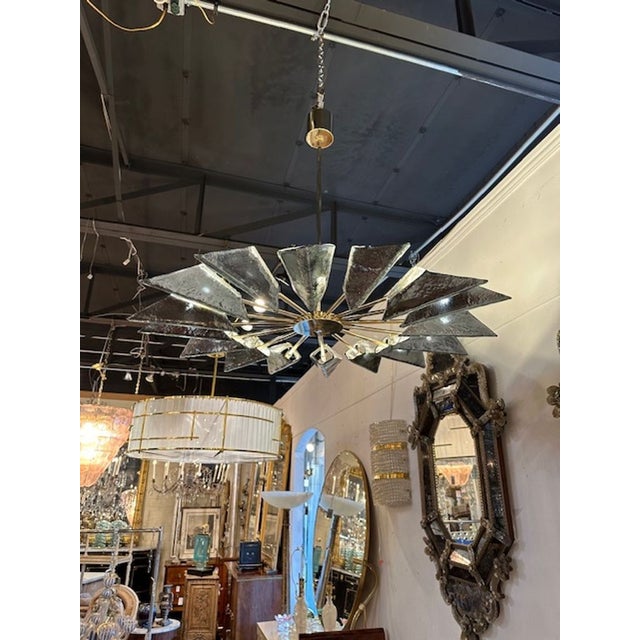Modern Murano glass and brass helicopter chandelier in Fontana green, Circa 2000. The chandelier has been professionally...