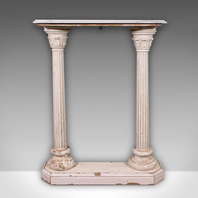 This is a charming antique Corinthian console table. An English, hallway or portico stand with a classic architectural...