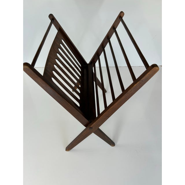Vintage mid-century, iconic modern folding newspaper rack made of rosewood. Designed to store your reading material or...