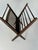 Vintage mid-century, iconic modern folding newspaper rack made of rosewood. Designed to store your reading material or...