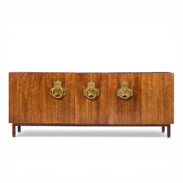Bert England for The John Widdicomb Orientation Group Mid Century Walnut and Brass Credenza This credenza measures: 82.5...