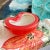A beautiful piece of Murano attributed glass, this coral bowl has an opaque outer casing with a white and gold inner...