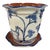 This charming hand-painted glazed ceramic planter pot comes complete with a matching attached-look drainage saucer base....