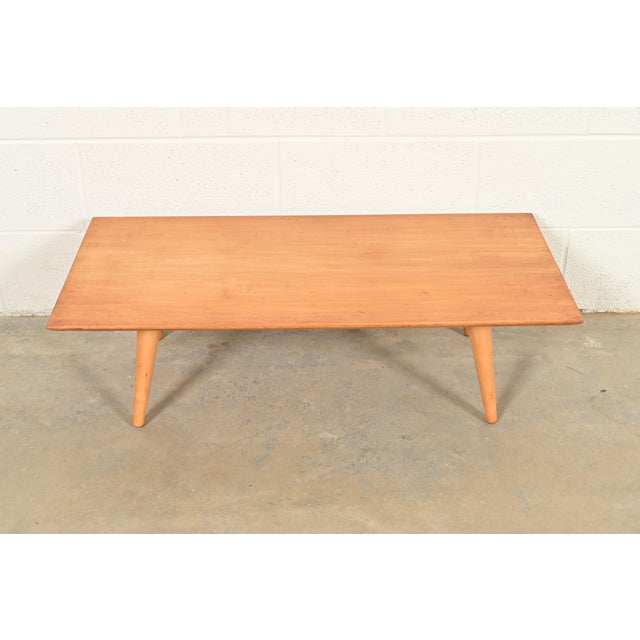 A sleek and stylish Mid-Century Modern solid maple low coffee table or cocktail table By Paul McCobb for Winchendon...