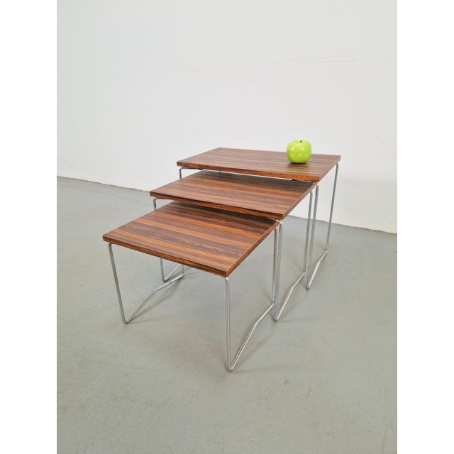 Mimiset Brabantia side nesting tables ‘60 This wooden miniset with chrome legs is by Brabantia Dutch design, 1960s. The...