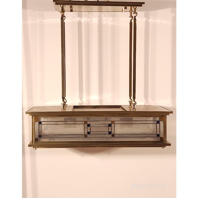 The Vintage Monumental Mission Arts and Crafts Prairie Frank Lloyd Wright Chandelier is a stunning fixture designed by...