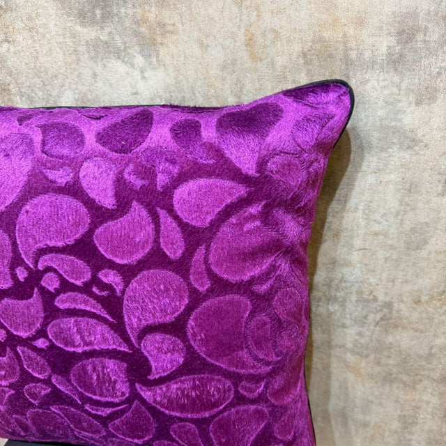 Overlapping rounded leaves and petal forms cover the full face in a single-color cut velvet composition, the pattern built...