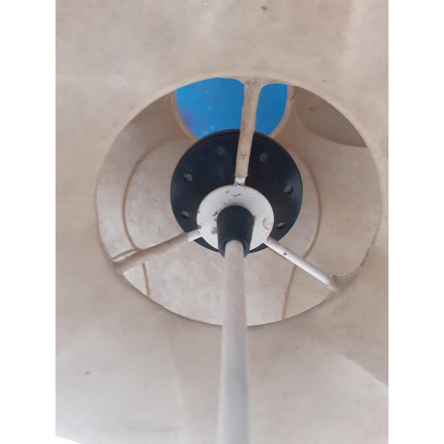 Flos chandelier designed by Achille Castiglioni, original from the 1970s, in cocoon material with a painted rod structure....