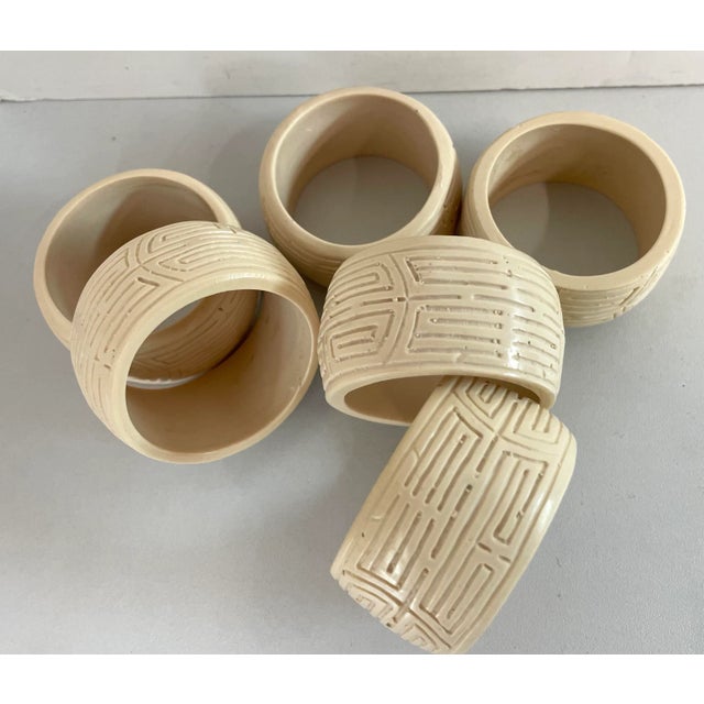 Nice set of six tribal etched pattern napkin rings in ecru.