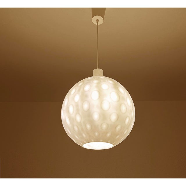 Very large mid century pendant light with a gourd shape glass shade with a semi translucent "golf ball" pattern, gilded...