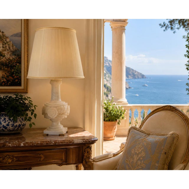 Few materials carry the quiet luxury of hand-carved alabaster, and this Italian lamp is a masterclass in the craft. The...